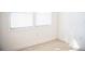 Bedroom with tile flooring, two bright windows, and white trim at 4840 Transport Rd, Bartow, FL 33830