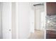 Bright hallway with tile flooring, white walls, closet, and doorways leading to other rooms at 4840 Transport Rd, Bartow, FL 33830