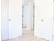 Bright hallway featuring neutral-toned flooring and multiple white doors, creating a clean and open feel at 4840 Transport Rd, Bartow, FL 33830
