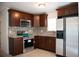Well-lit kitchen featuring stainless steel appliances, granite countertops, and modern tile backsplash at 4840 Transport Rd, Bartow, FL 33830