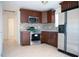Eat-in kitchen with stainless appliances, granite countertops and tile floors at 4840 Transport Rd, Bartow, FL 33830