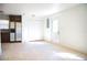 Kitchenette with tile floors, stainless fridge, wood cabinets, and closet at 4840 Transport Rd, Bartow, FL 33830