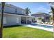 Exterior view of a home featuring a swimming pool, patio, and grassy backyard at 5006 Legacy Oaks Dr, Orlando, FL 32839