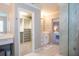 Gorgeous Primary bath featuring a walk-in closet, double vanities, and a luxurious glass shower at 5006 Legacy Oaks Dr, Orlando, FL 32839
