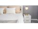 Comfortable bedroom featuring a plush bed, stylish nightstand, and soft lighting at 5006 Legacy Oaks Dr, Orlando, FL 32839