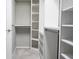 Walk-in closet with custom shelving, ample storage, and carpet flooring, perfect for organizing your wardrobe at 5006 Legacy Oaks Dr, Orlando, FL 32839