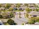 A car enters the Legacy community through brick pillars, iron gates, and lush landscaping at 5006 Legacy Oaks Dr, Orlando, FL 32839