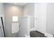 Upstairs hallway with gray walls, white door, and dark laminate flooring at 5006 Legacy Oaks Dr, Orlando, FL 32839
