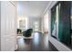 Inviting hallway leads to a cozy living area with stylish decor and ample natural light at 5006 Legacy Oaks Dr, Orlando, FL 32839