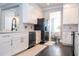 Bright kitchen features white cabinets, modern appliances and an open design leading into the dining area at 5006 Legacy Oaks Dr, Orlando, FL 32839