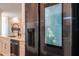 Close-up of a stainless steel smart refrigerator with a digital display in a modern kitchen at 5006 Legacy Oaks Dr, Orlando, FL 32839