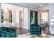 Spacious open-concept living area shows a dining area, kitchen, and decorative fireplace at 5006 Legacy Oaks Dr, Orlando, FL 32839