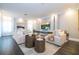 Elegant living room showcasing modern decor, a large TV, recessed lighting, and comfortable seating at 5006 Legacy Oaks Dr, Orlando, FL 32839