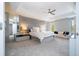 Spacious main bedroom with a cozy bed, tray ceilings, modern decor, and lots of room to relax at 5006 Legacy Oaks Dr, Orlando, FL 32839