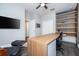 Bright office with a large desk, modern shelving, and stylish decor for a productive workspace at 5006 Legacy Oaks Dr, Orlando, FL 32839