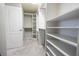Spacious walk-in closet featuring custom shelving and ample storage space at 5006 Legacy Oaks Dr, Orlando, FL 32839