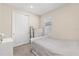 Bright bedroom featuring plush carpet, a sliding-door closet, and a comfortable bed at 5058 Sparkling Water Way, Kissimmee, FL 34746