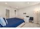 Spacious main bedroom boasts plush carpet, a stylish accent chair, and modern furnishings at 5058 Sparkling Water Way, Kissimmee, FL 34746