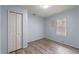 Bedroom with new flooring and a double door closet at 519 Pearl St, Mascotte, FL 34753