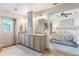 Main bathroom with dual sinks, granite counters, and neutral color palette next to the main bedroom at 598 Palm Dr, Oviedo, FL 32765