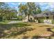 Expansive home with a sprawling lawn and mature landscaping at 598 Palm Dr, Oviedo, FL 32765