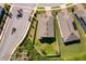 Home with manicured lawn, fenced backyard, and proximity to a quiet neighborhood street, captured from an aerial perspective at 6097 Monterey Cypress Trl, Sanford, FL 32773