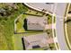 Home with manicured lawn, fenced backyard, and proximity to a quiet neighborhood street, captured from an aerial perspective at 6097 Monterey Cypress Trl, Sanford, FL 32773