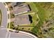 Aerial view of a well-maintained home featuring a manicured lawn, fenced backyard, and proximity to a quiet neighborhood street at 6097 Monterey Cypress Trl, Sanford, FL 32773