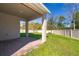 Enjoy outdoor living on this covered back patio, overlooking a well-maintained lawn and fenced yard at 6097 Monterey Cypress Trl, Sanford, FL 32773