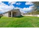 A spacious backyard with lush green grass and a privacy fence, perfect for outdoor activities and relaxation at 6097 Monterey Cypress Trl, Sanford, FL 32773