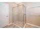 Modern bathroom features a glass-enclosed shower with tiled walls and floor at 6097 Monterey Cypress Trl, Sanford, FL 32773