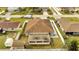 Aerial view of the backyard with a shed and white fence at 639 Mesilla Dr, Kissimmee, FL 34758