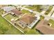 Aerial view of a home with a fenced yard, shed, and driveway in a residential neighborhood at 639 Mesilla Dr, Kissimmee, FL 34758