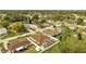 Aerial view of a neighborhood featuring many houses in a wooded area at 639 Mesilla Dr, Kissimmee, FL 34758