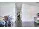 Long hallway featuring dark wood floors connecting the main living spaces at 639 Mesilla Dr, Kissimmee, FL 34758