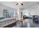 Open-concept room featuring dark wood floors and plenty of natural light at 639 Mesilla Dr, Kissimmee, FL 34758