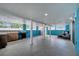 Spacious patio with tiled floors, a grill, kitchen, and ample natural light at 639 Mesilla Dr, Kissimmee, FL 34758