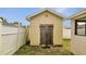 Backyard shed with wooden doors and ample storage space at 639 Mesilla Dr, Kissimmee, FL 34758