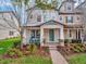 Charming two-story home with a welcoming porch and well-maintained landscaping at 7345 Duxbury Ln, Winter Garden, FL 34787