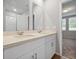 Bathroom featuring a double vanity with plenty of counter space and modern fixtures at 869 Rivers Crossing St, Clermont, FL 34714