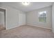 Inviting bedroom featuring neutral walls, plush carpeting, and a large closet for storage at 869 Rivers Crossing St, Clermont, FL 34714