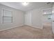 Bedroom with plush carpeting, neutral walls, and a closet, creating a relaxing atmosphere at 869 Rivers Crossing St, Clermont, FL 34714