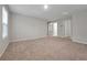 Spacious upstairs bonus room with lots of natural light and plush carpeting at 869 Rivers Crossing St, Clermont, FL 34714