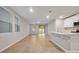 Bright living room with tile floors, white walls, and sliding doors to the backyard at 869 Rivers Crossing St, Clermont, FL 34714