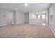 Expansive loft space perfect for entertaining or relaxation with natural light and plush carpeting at 869 Rivers Crossing St, Clermont, FL 34714