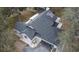 Aerial view of a gray roof on a home, featuring solar panels and seamless gutters at 1102 Hamlin Ave, Howey In The Hills, FL 34737
