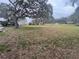 Spacious backyard featuring a large oak tree and plenty of room at 1102 Hamlin Ave, Howey In The Hills, FL 34737