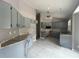 Kitchen with updated cabinets, countertops, a ceiling fan, and tile flooring at 1102 Hamlin Ave, Howey In The Hills, FL 34737