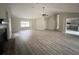 Spacious living room with a fireplace and open floor plan, showcasing abundant natural light at 1102 Hamlin Ave, Howey In The Hills, FL 34737