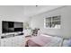 Bright bedroom with a TV, dresser, and window with natural light at 11336 Bingham Ct, Orlando, FL 32837